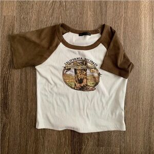 Brown and white cow girl graphic baby tee